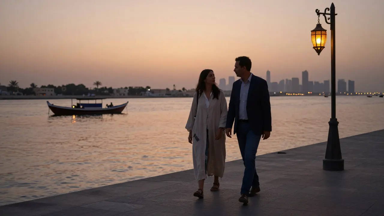 A couple walking peacefully along Dubai Creek at dusk, lanterns glowing over the water.